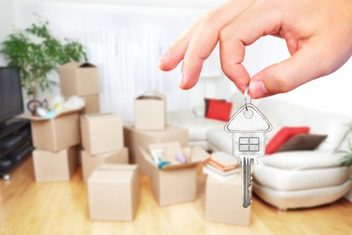 Careful wrapping of fragile household items during a packing service