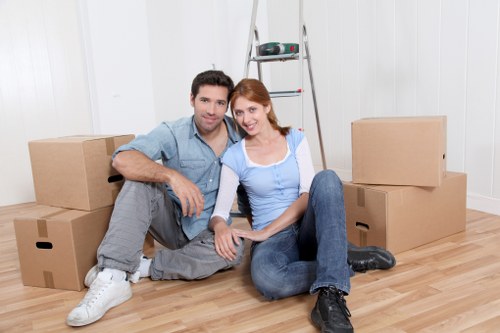 Professional movers loading items for a local relocation