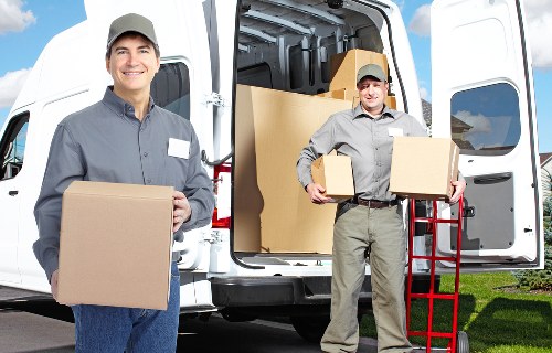 Helper carrying boxes during a man and van move in Wandsworth